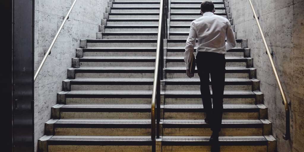 Man walking up stairs