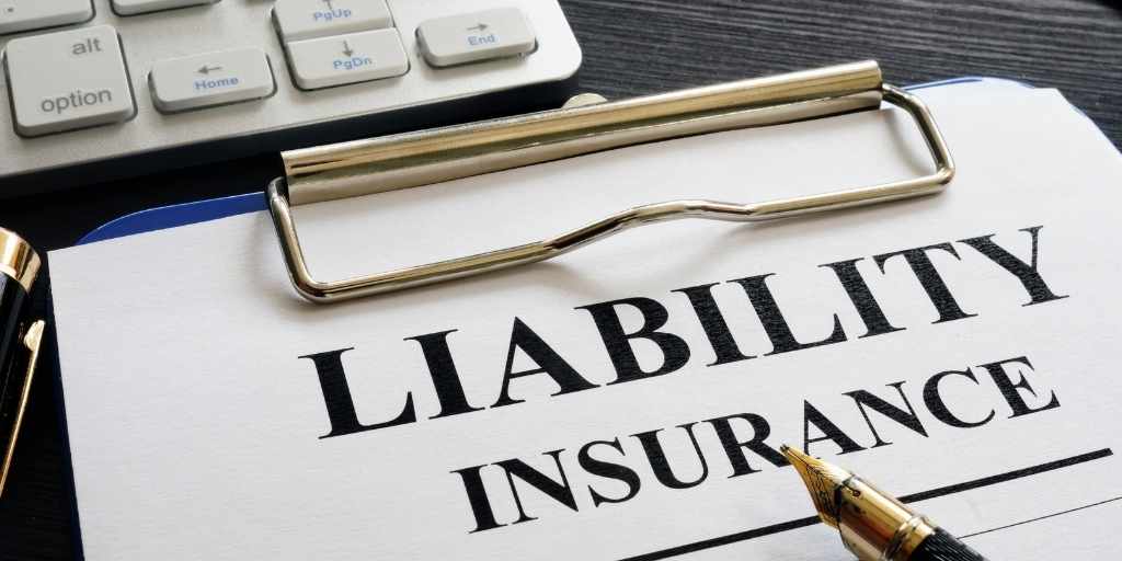 Liability Insurance paper on a clipboard