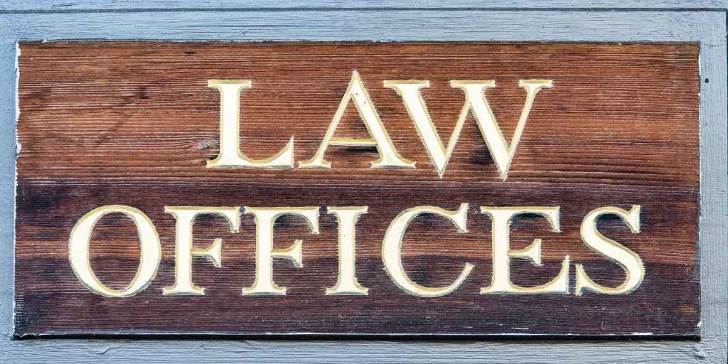 wooden law offices sign