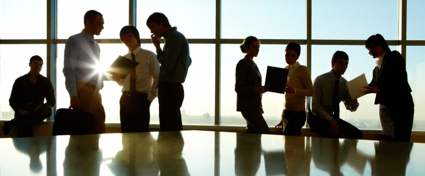 People standing in front of a window