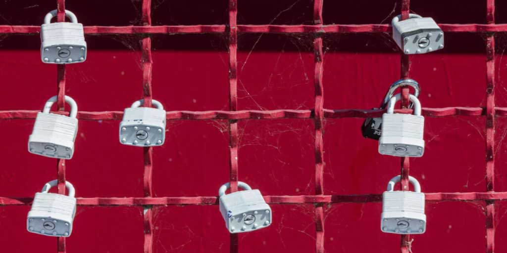 several locks on a fence